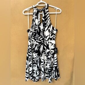 Black and White Floral Halter Dress above knees.